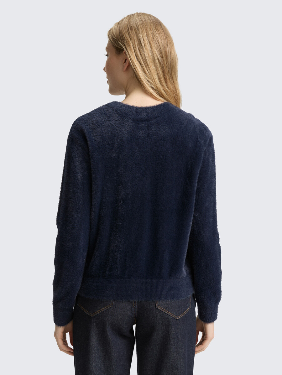 gilet en fil de plumes avec patte de boutonnage