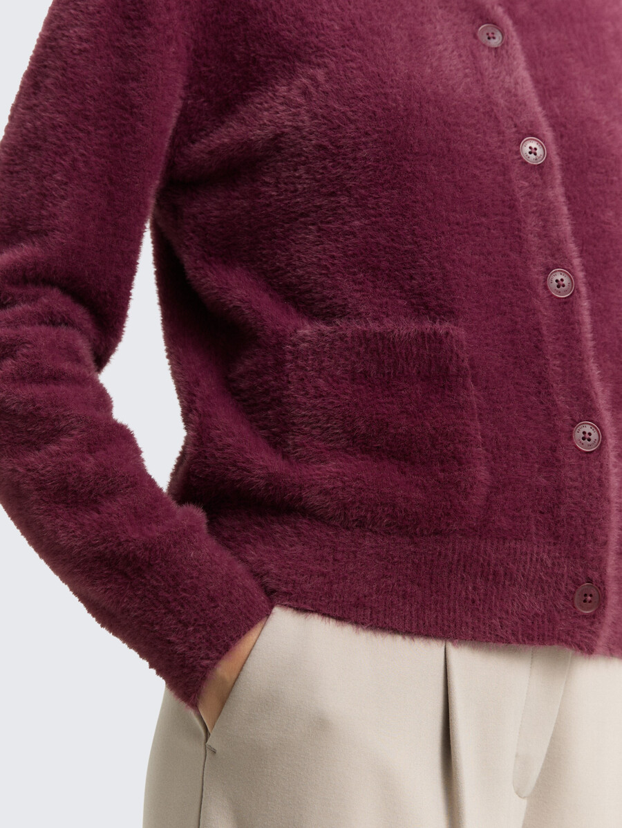 gilet en fil de plumes avec patte de boutonnage