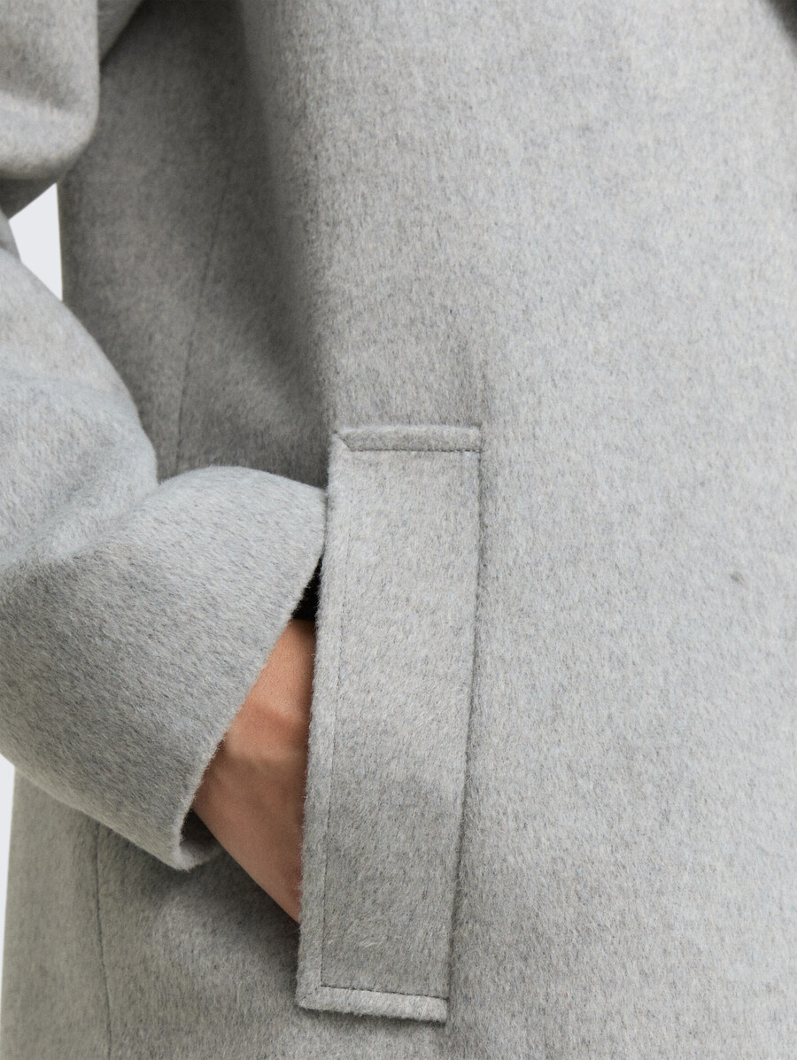 manteau en laine à poches fendues