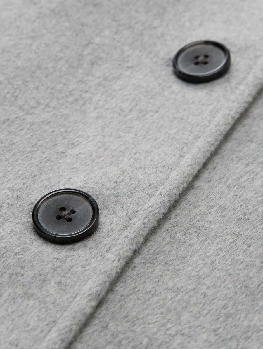 manteau en laine à poches fendues