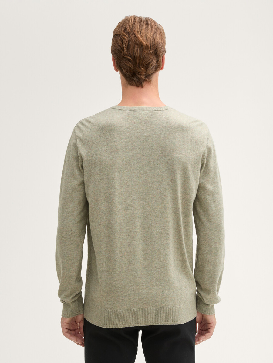pull en maille avec badge logo
