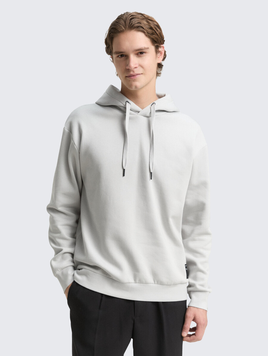 sweat à capuche avec badge logo