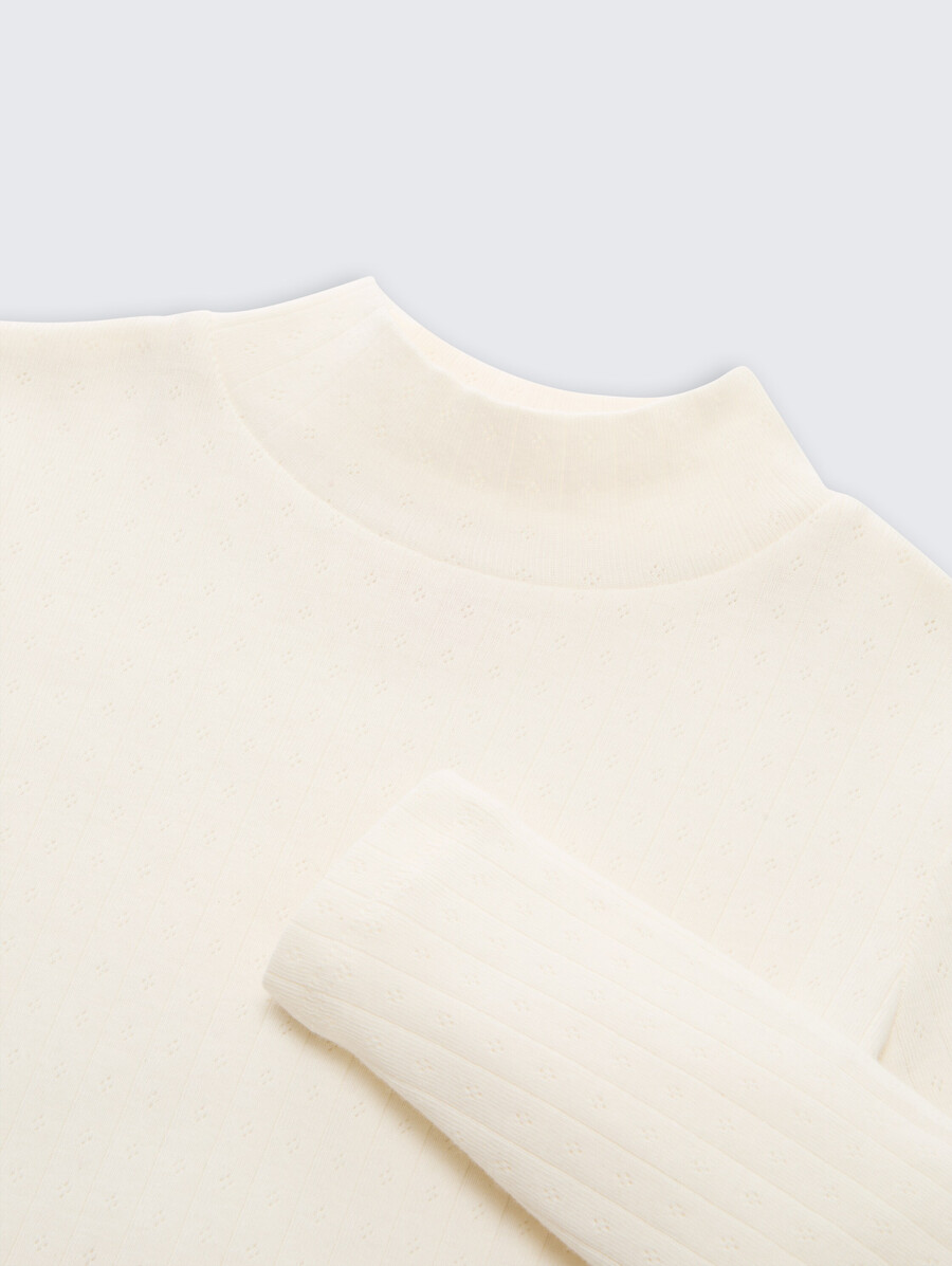 chemise à manches longues en maille ajourée avec col roulé