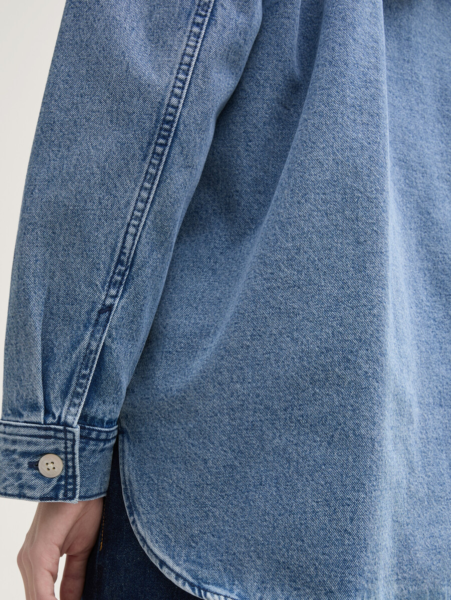 veste en jean à poches fendues