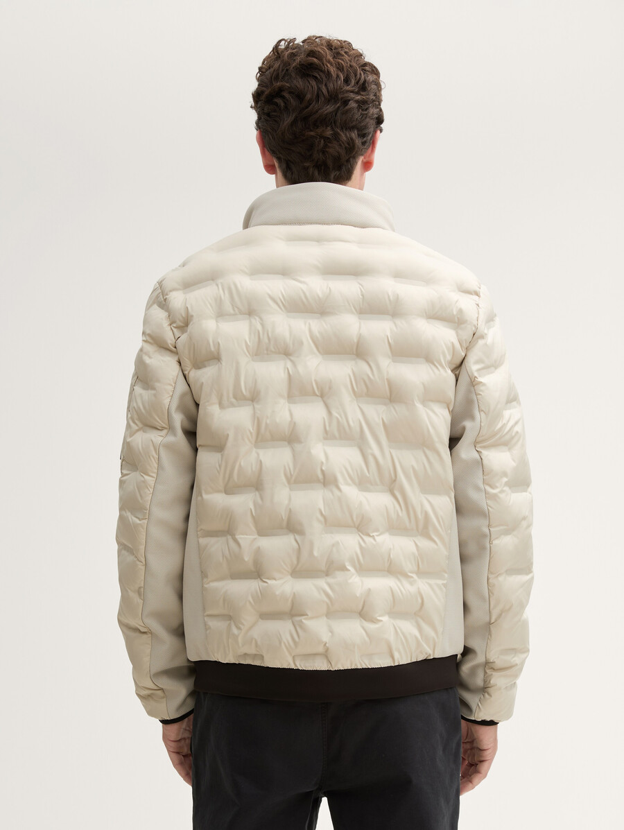 veste matelassée hybride légère à capuche et col montant